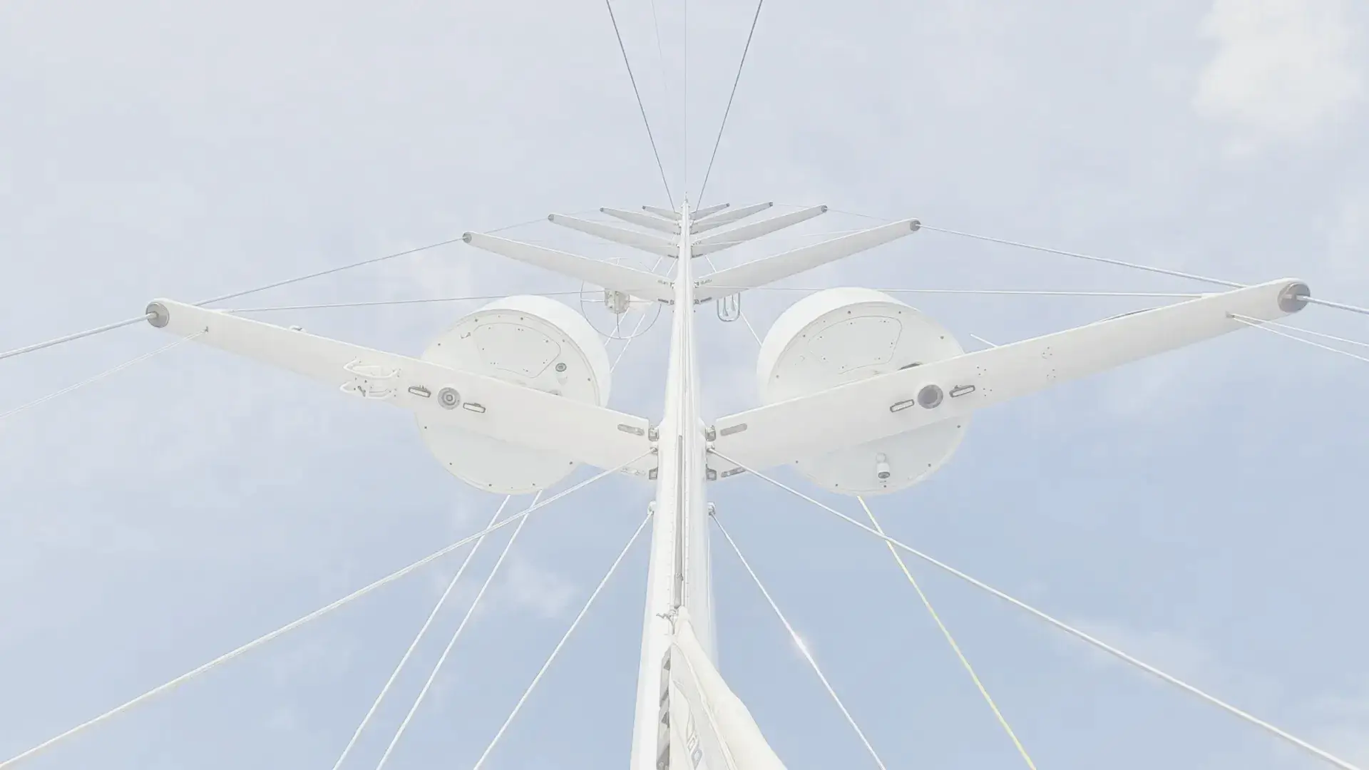 Looking up Phoenix's mast into a bright Caribbean sky